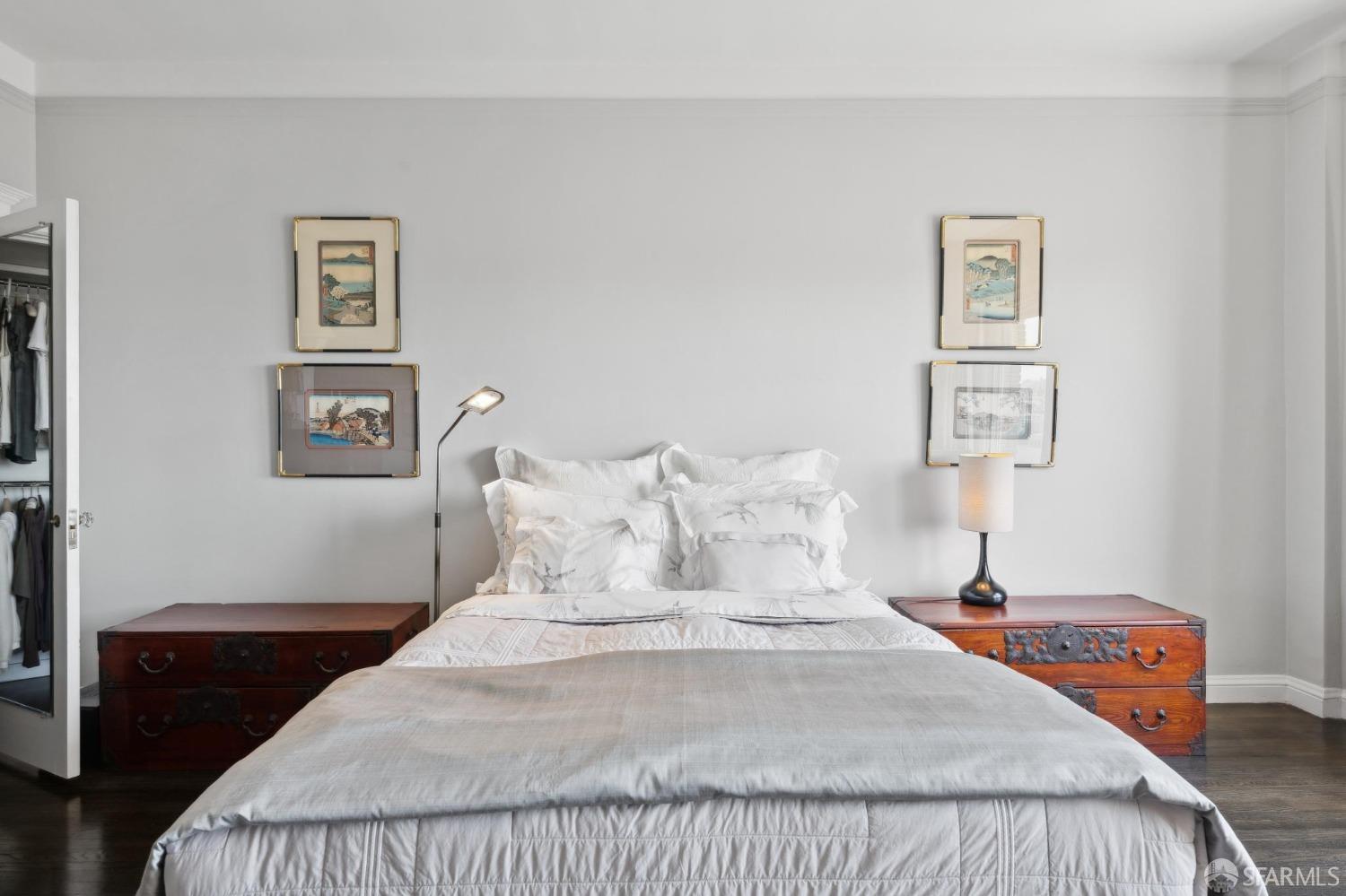 2111 Hyde Street, Unit 403 San Francisco, CA 94109 - Photo 41 of 60 a bedroom with bed and painting on the wall