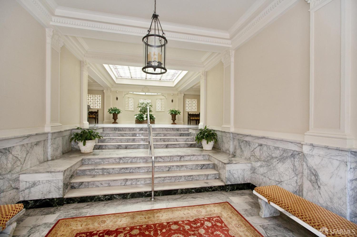 2111 Hyde Street, Unit 403 San Francisco, CA 94109 - Photo 9 of 60 a view of spacious bedroom with a bed and chandelier