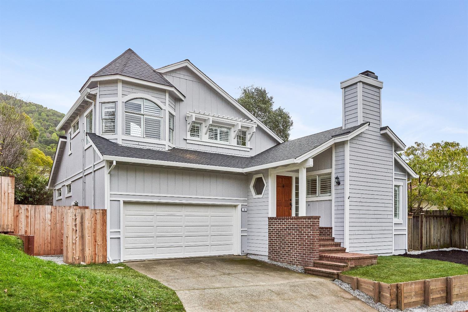 a front view of a house with a yard
