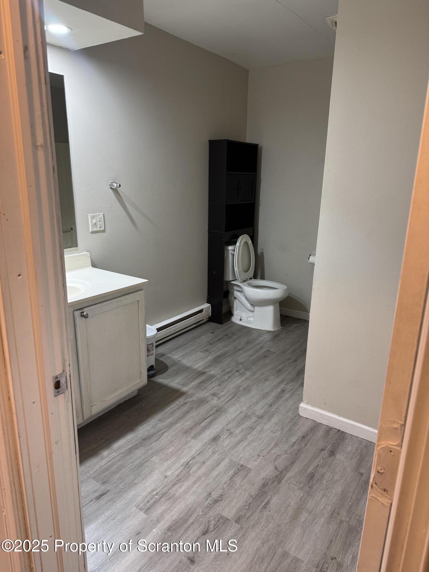 114 Prospect Avenue, Unit 1ST FL FRONT Scranton, PA 18505 - Photo 2 of 10 a bathroom with a sink and a toilet