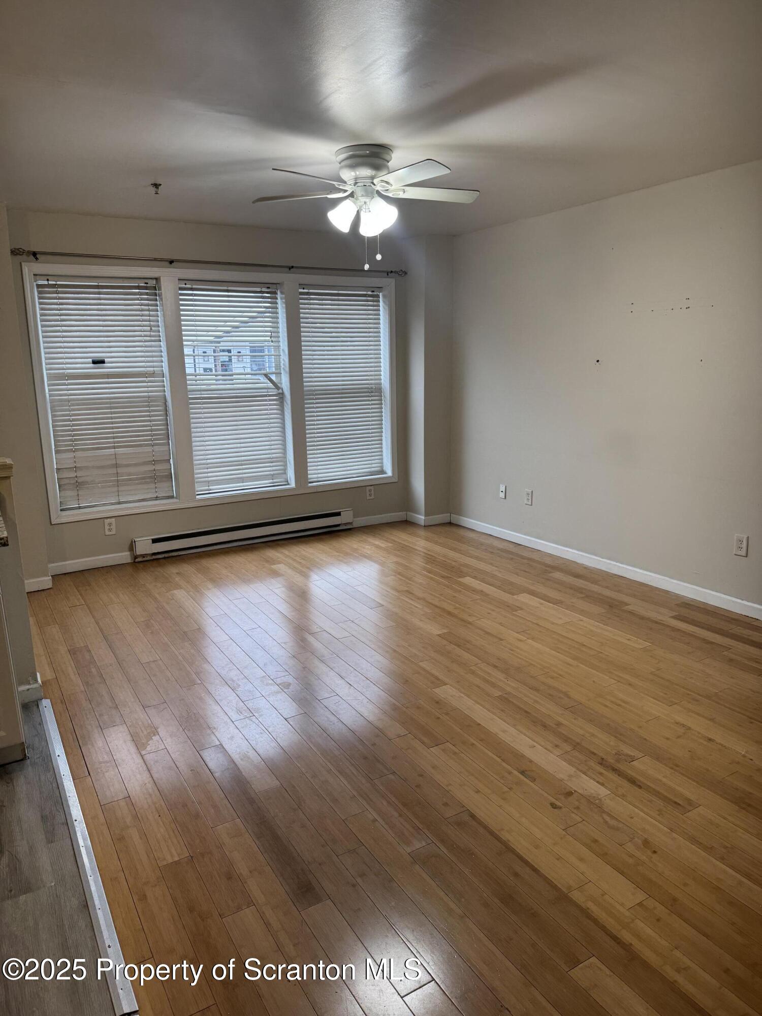 114 Prospect Avenue, Unit 1ST FL FRONT Scranton, PA 18505 - Photo 10 of 10 a view of a room with wooden floor