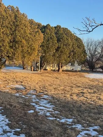 a view of ocean with a building in the background