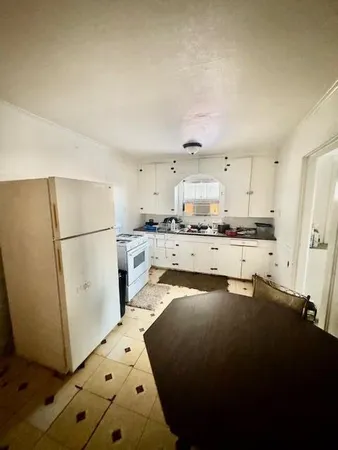 a bathroom with a sink toilet and mirror