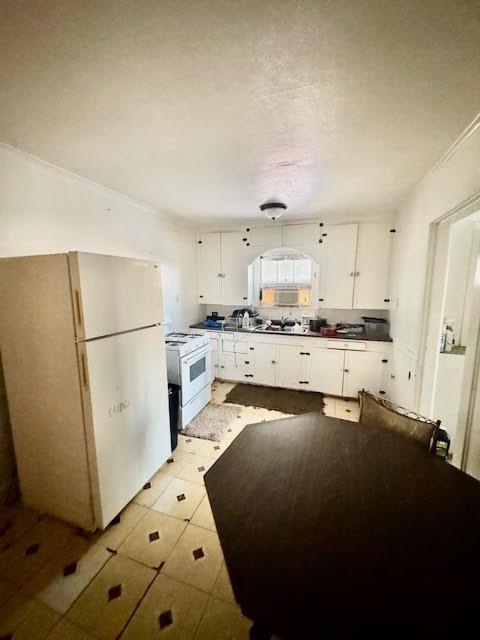 1601 Peterson Road South Iowa Park, TX 76367 - Photo 5 of 13 a kitchen with stainless steel appliances a refrigerator a sink a stove a microwave and cabinets