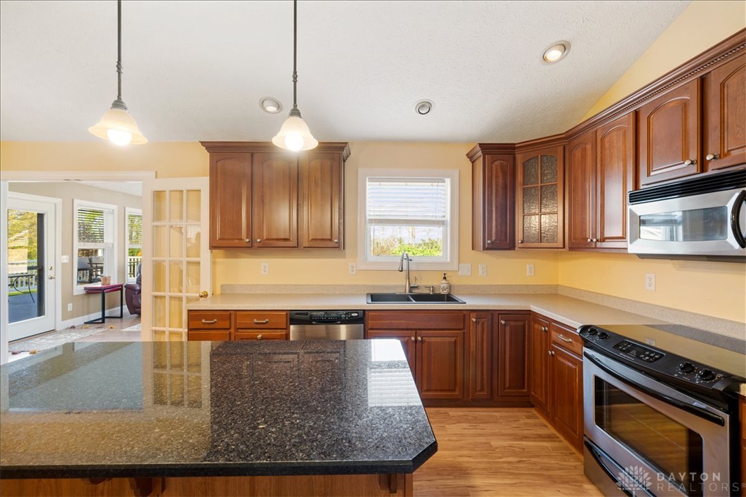 841 Willow Road Springfield, OH 45502 - Photo 10 of 64 This bright kitchen features ample cabinetry, an inviting island, and access to outdoor living.