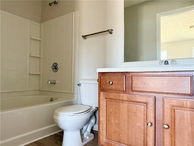 a bathroom with a sink a toilet and a bathtub