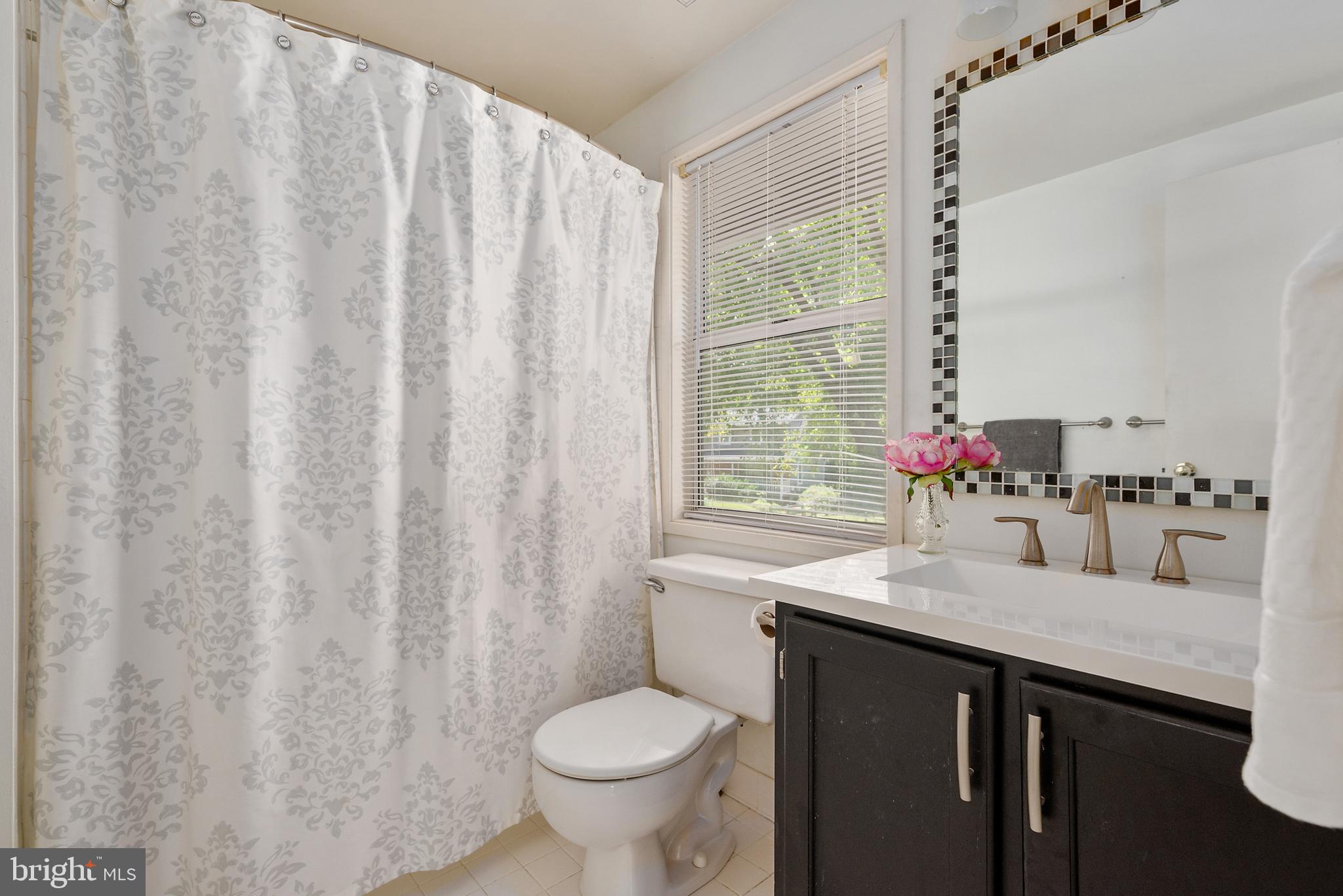 1522 Ainsley Road Silver Spring, MD 20904 - Photo 23 of 46 master bedroom with tile floor and surround