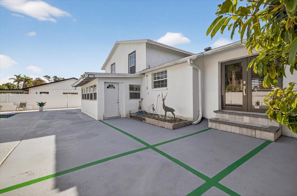 7613 Rustic Drive Tampa, FL 33634 - Photo 24 of 68 a view of a house with backyard and sitting area