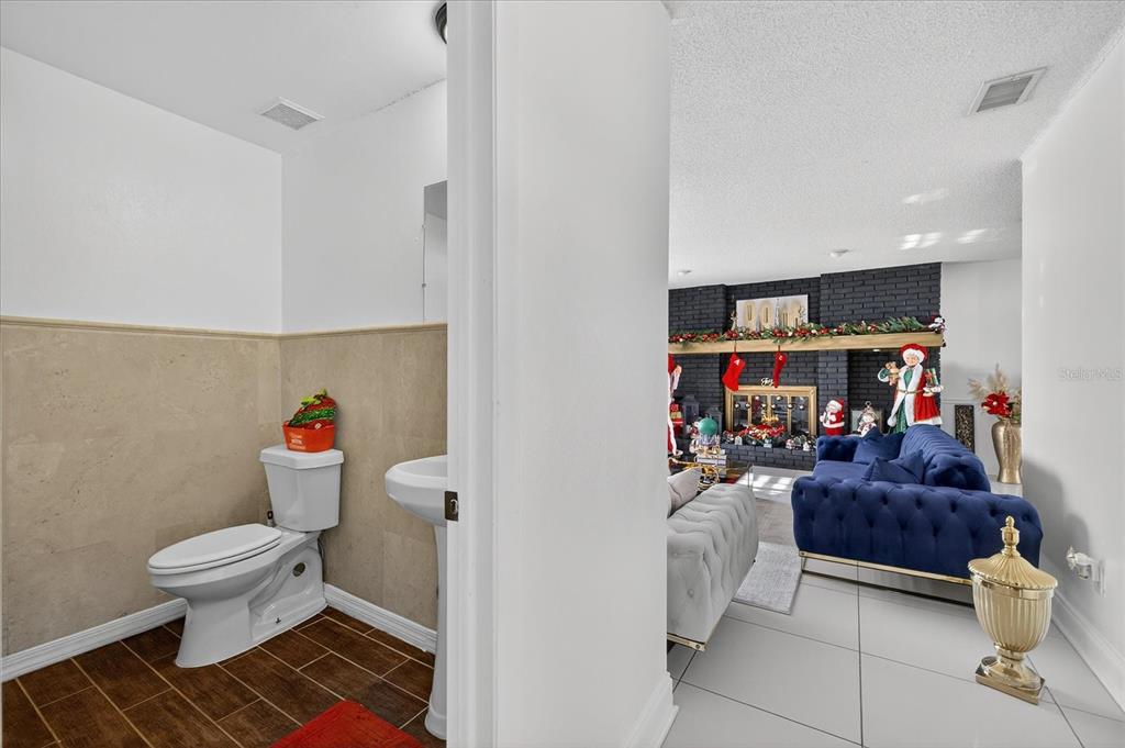 7613 Rustic Drive Tampa, FL 33634 - Photo 27 of 68 a living room with furniture and a rug