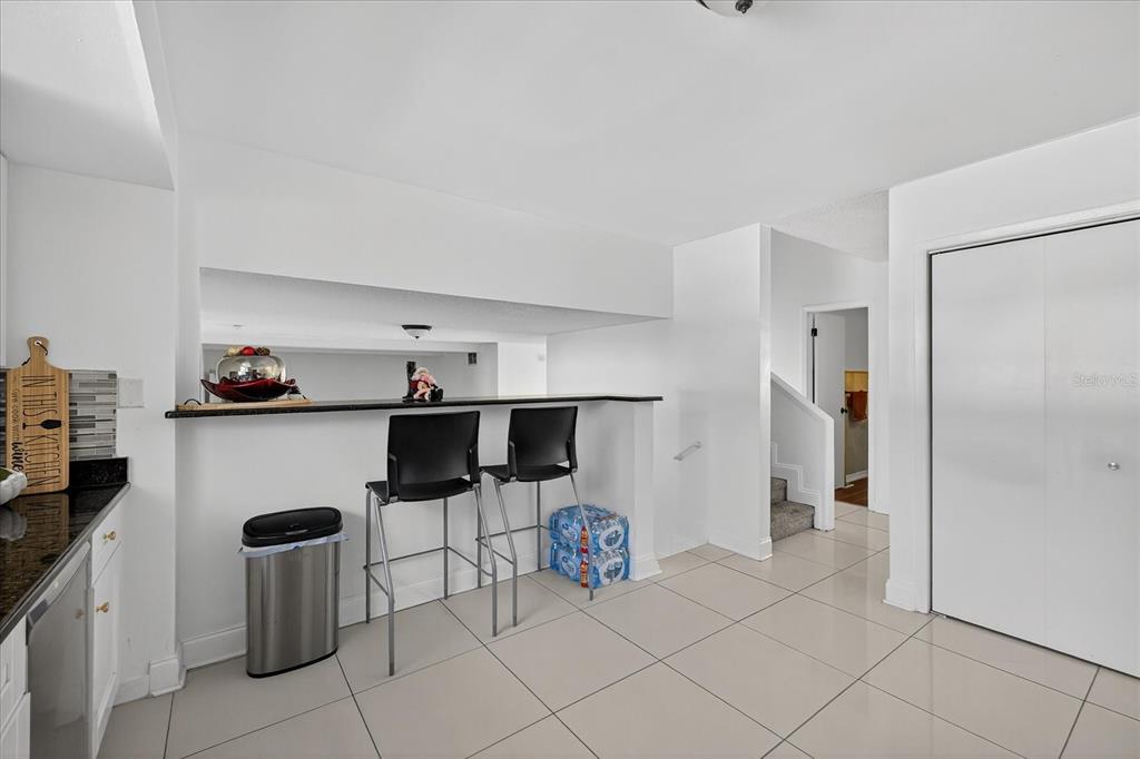 7613 Rustic Drive Tampa, FL 33634 - Photo 37 of 68 a kitchen with stainless steel appliances granite countertop a refrigerator and a stove top oven