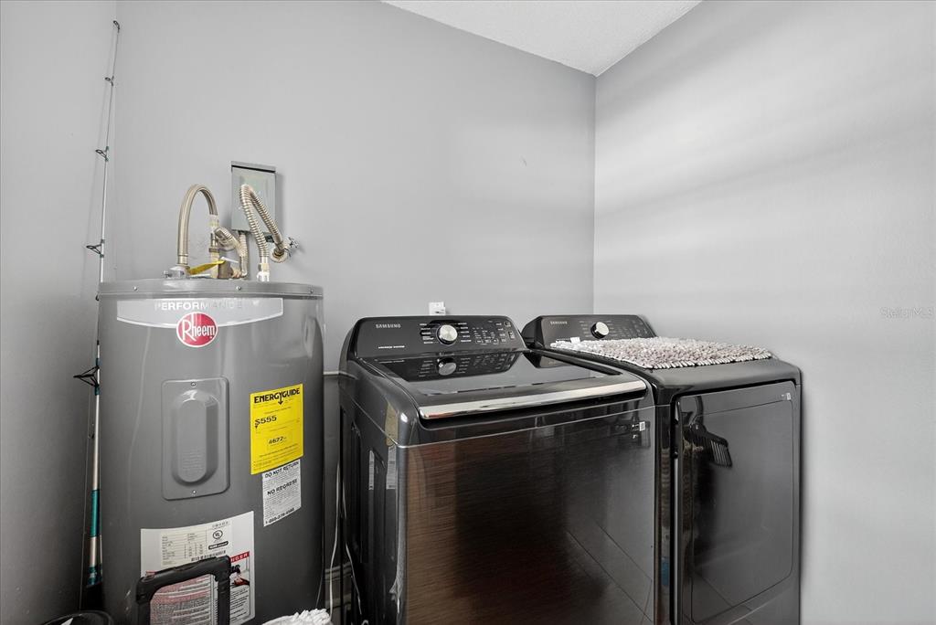 7613 Rustic Drive Tampa, FL 33634 - Photo 42 of 68 a utility room with dryer and washer