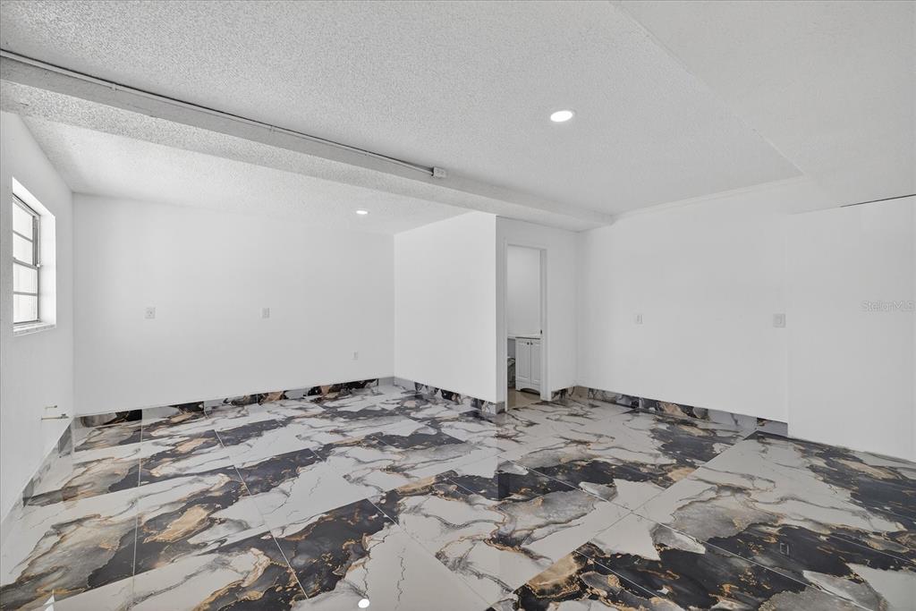 7613 Rustic Drive Tampa, FL 33634 - Photo 43 of 68 a view of an empty room