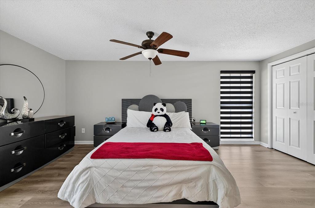 7613 Rustic Drive Tampa, FL 33634 - Photo 57 of 68 a bedroom with a bed and a dresser