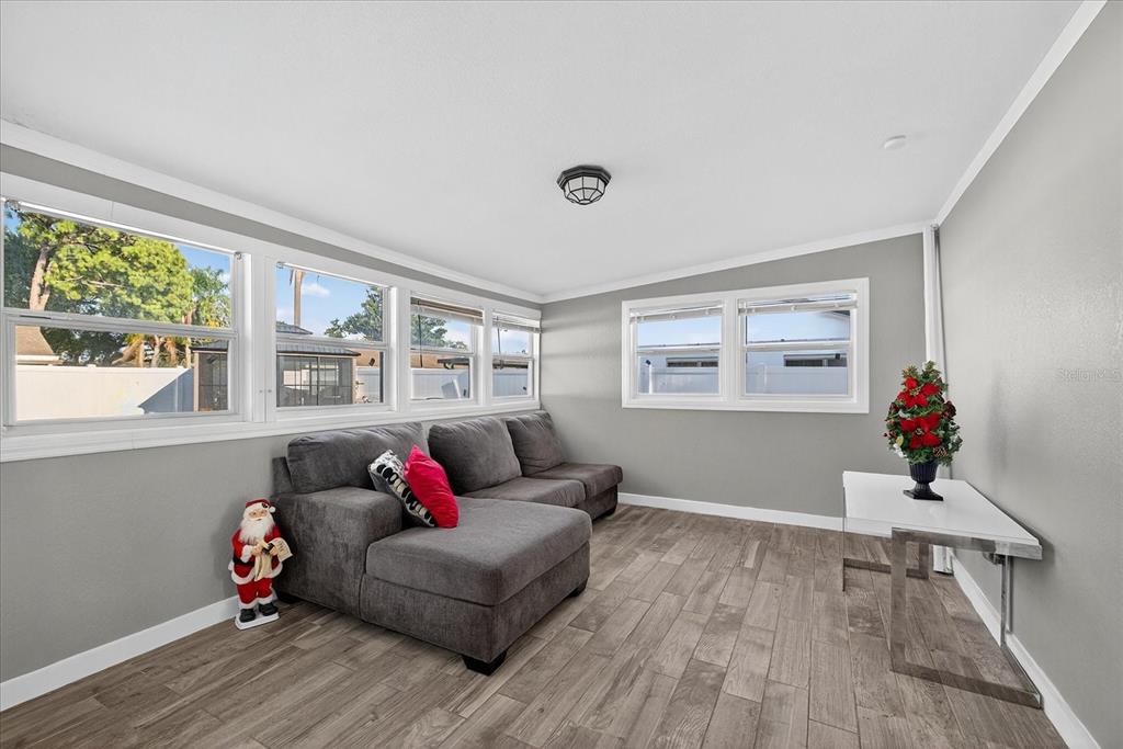 7613 Rustic Drive Tampa, FL 33634 - Photo 66 of 68 a living room with furniture and a window