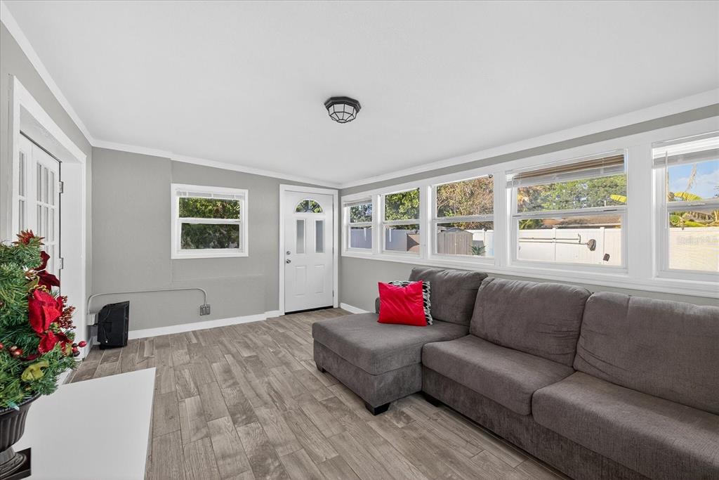 7613 Rustic Drive Tampa, FL 33634 - Photo 68 of 68 a living room with furniture and a large window