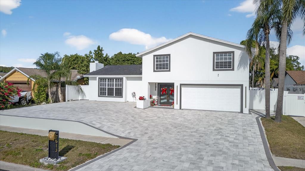 7613 Rustic Drive Tampa, FL 33634 - Photo 9 of 68 a view of a house with a patio