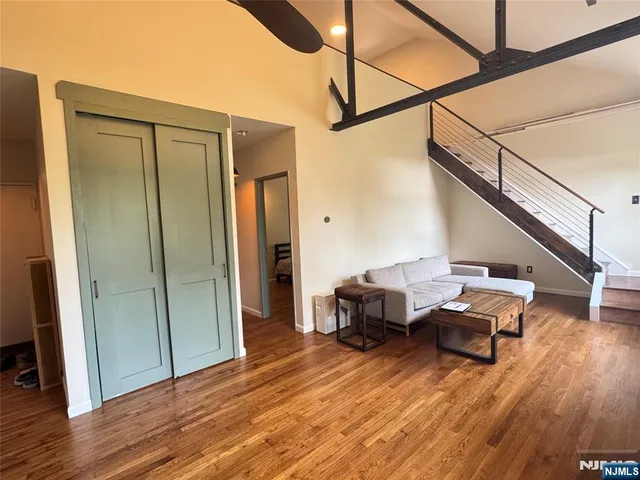a view of a livingroom with furniture and hardwood floor
