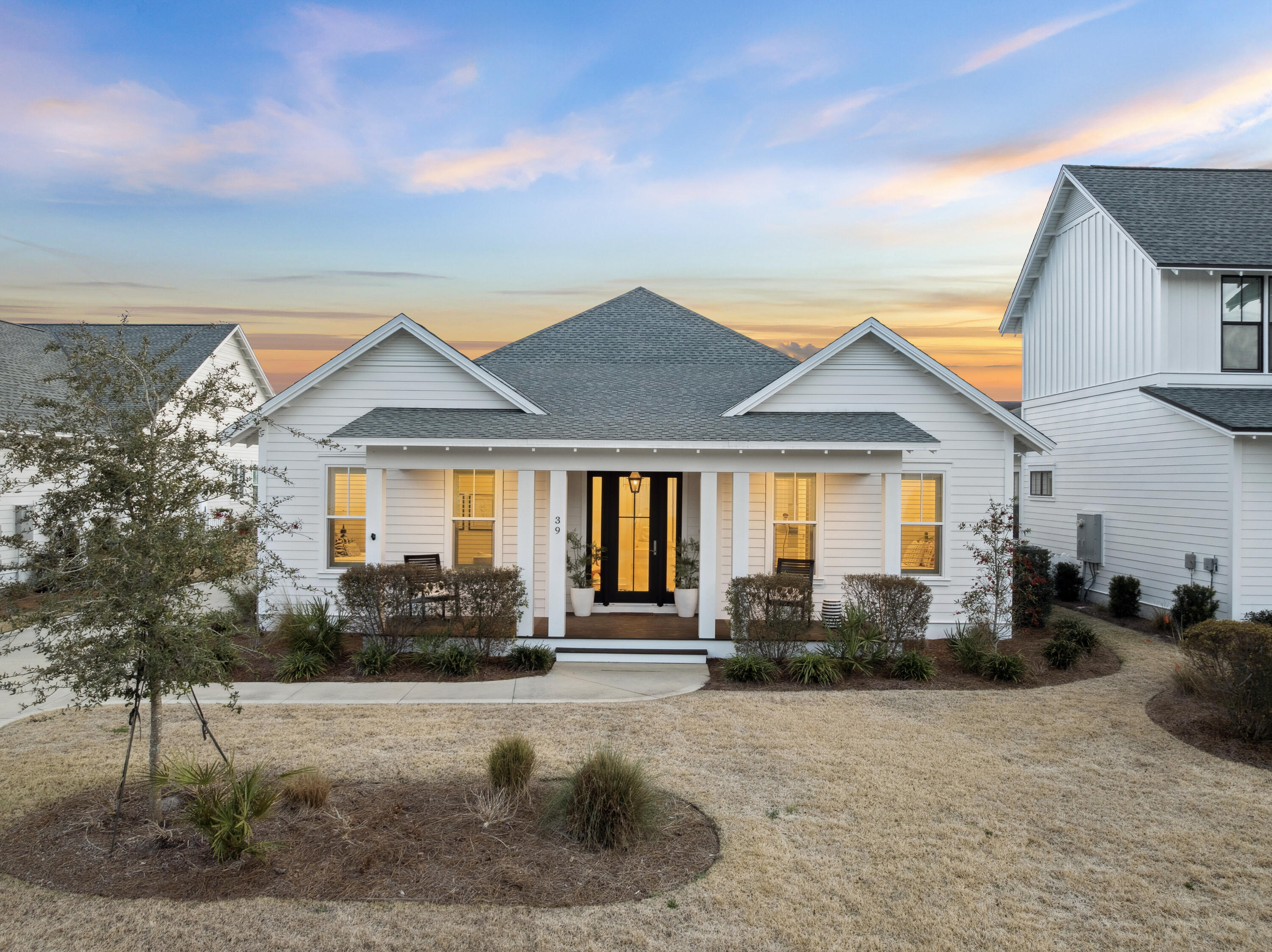 39 West Firethorn Circle Watersound, FL 32461 - Photo 1 of 33 a front view of a house with garden
