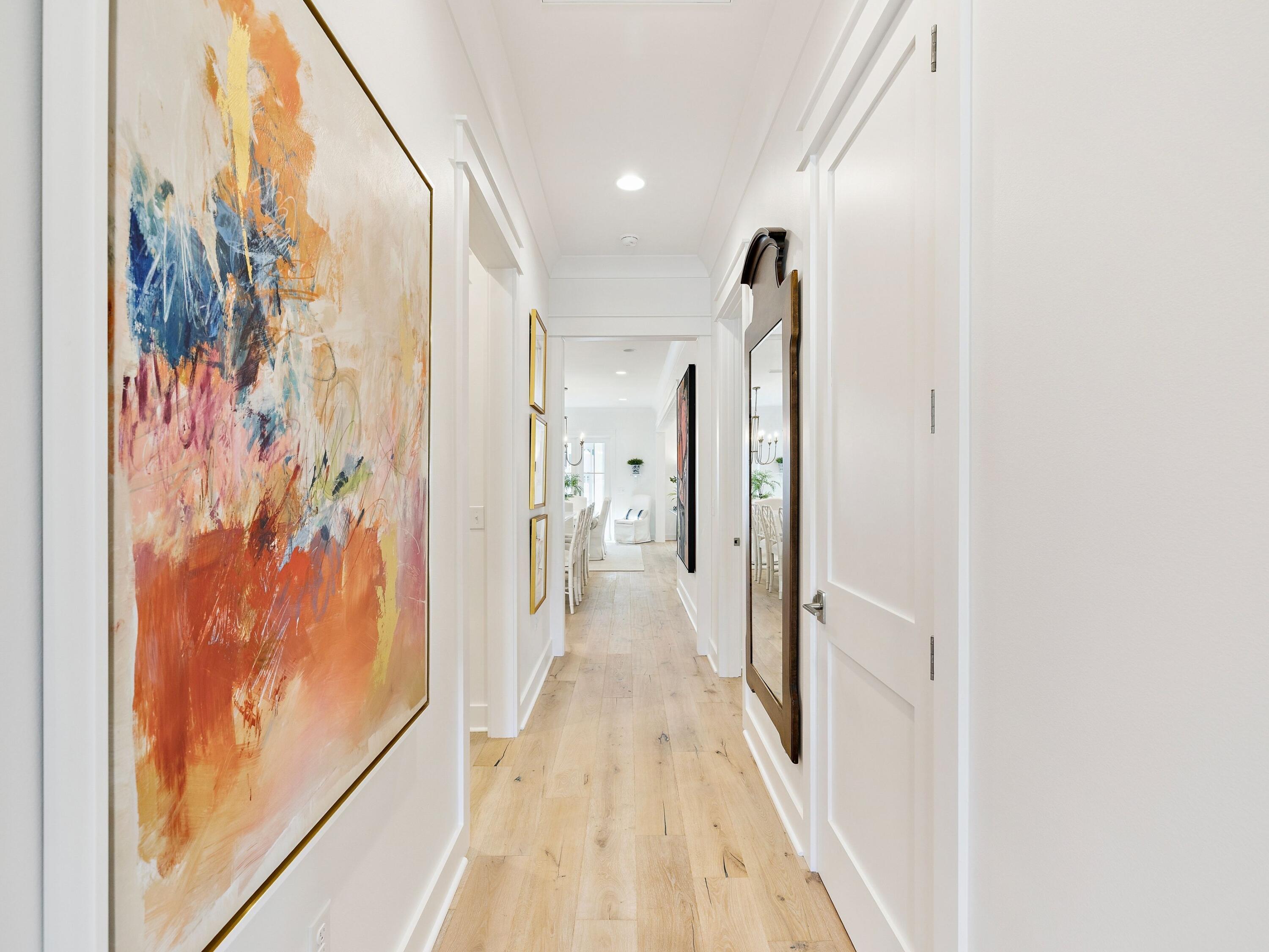 39 West Firethorn Circle Watersound, FL 32461 - Photo 13 of 33 a view of a hallway with wooden floor and door