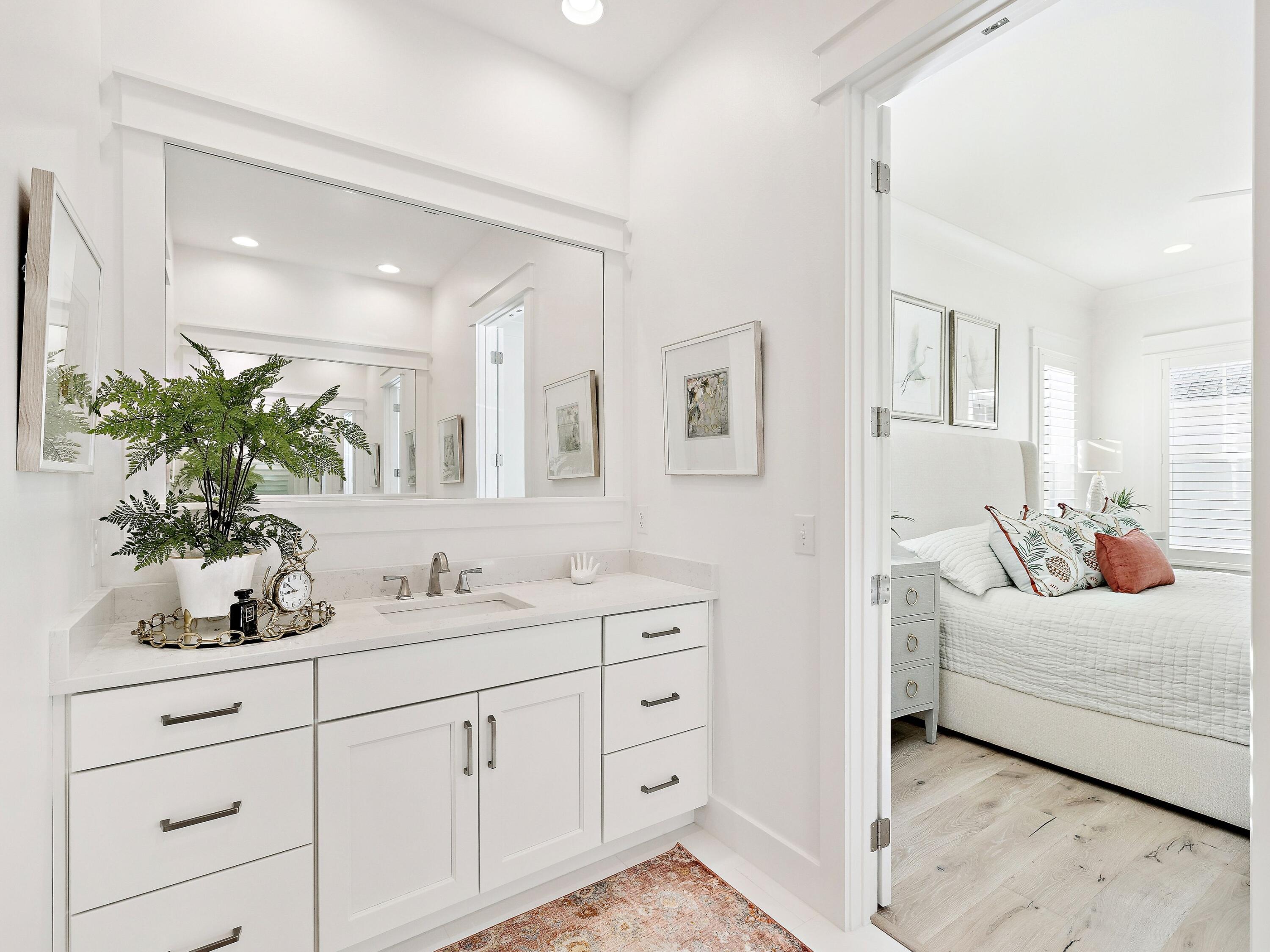 39 West Firethorn Circle Watersound, FL 32461 - Photo 23 of 33 a en suite bathroom with double sink and a mirror
