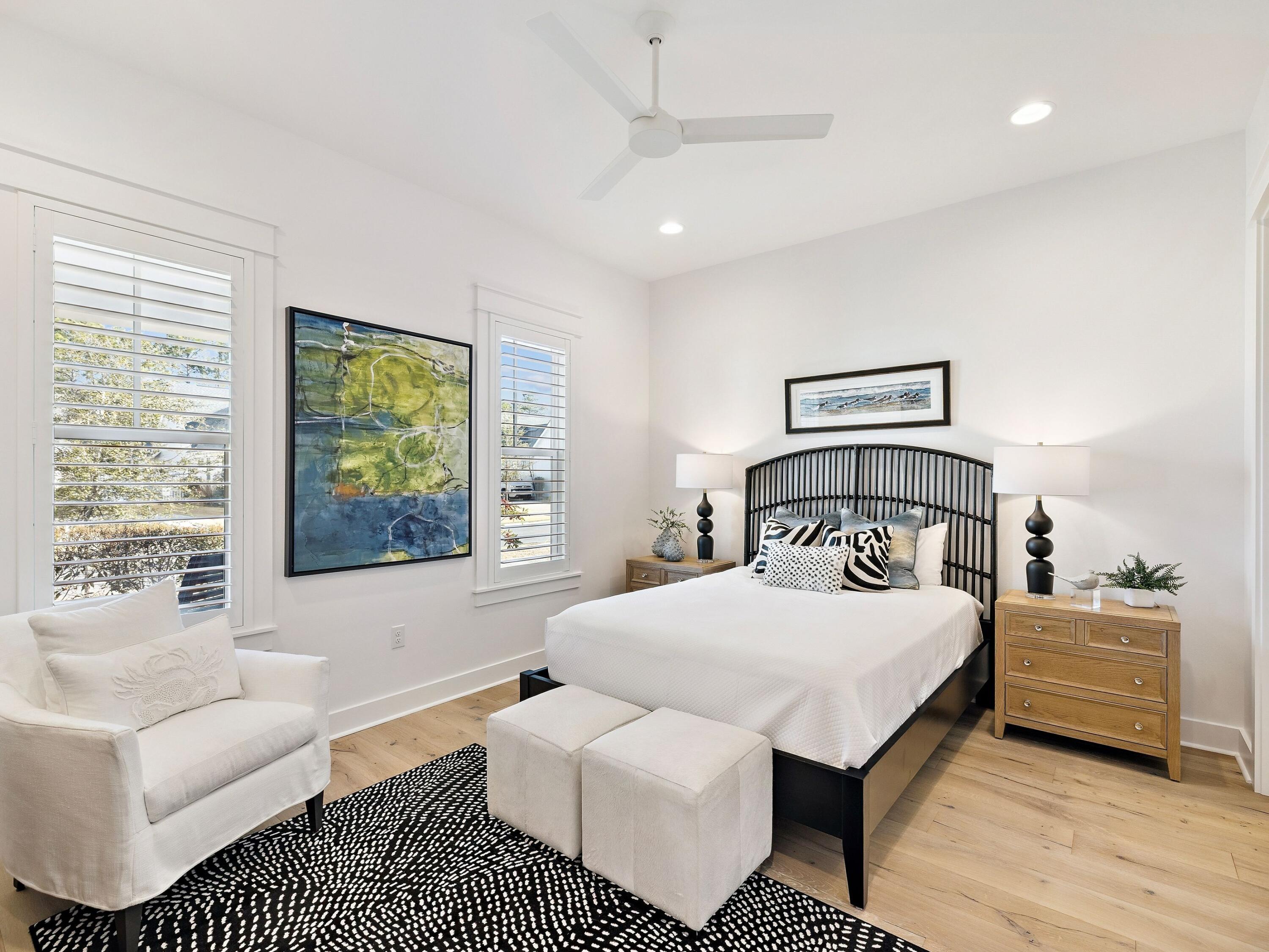 39 West Firethorn Circle Watersound, FL 32461 - Photo 7 of 33 a bedroom with a bed a couch and a window
