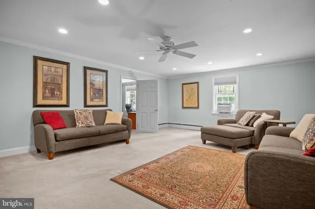 a kitchen with a table chairs sink and cabinets