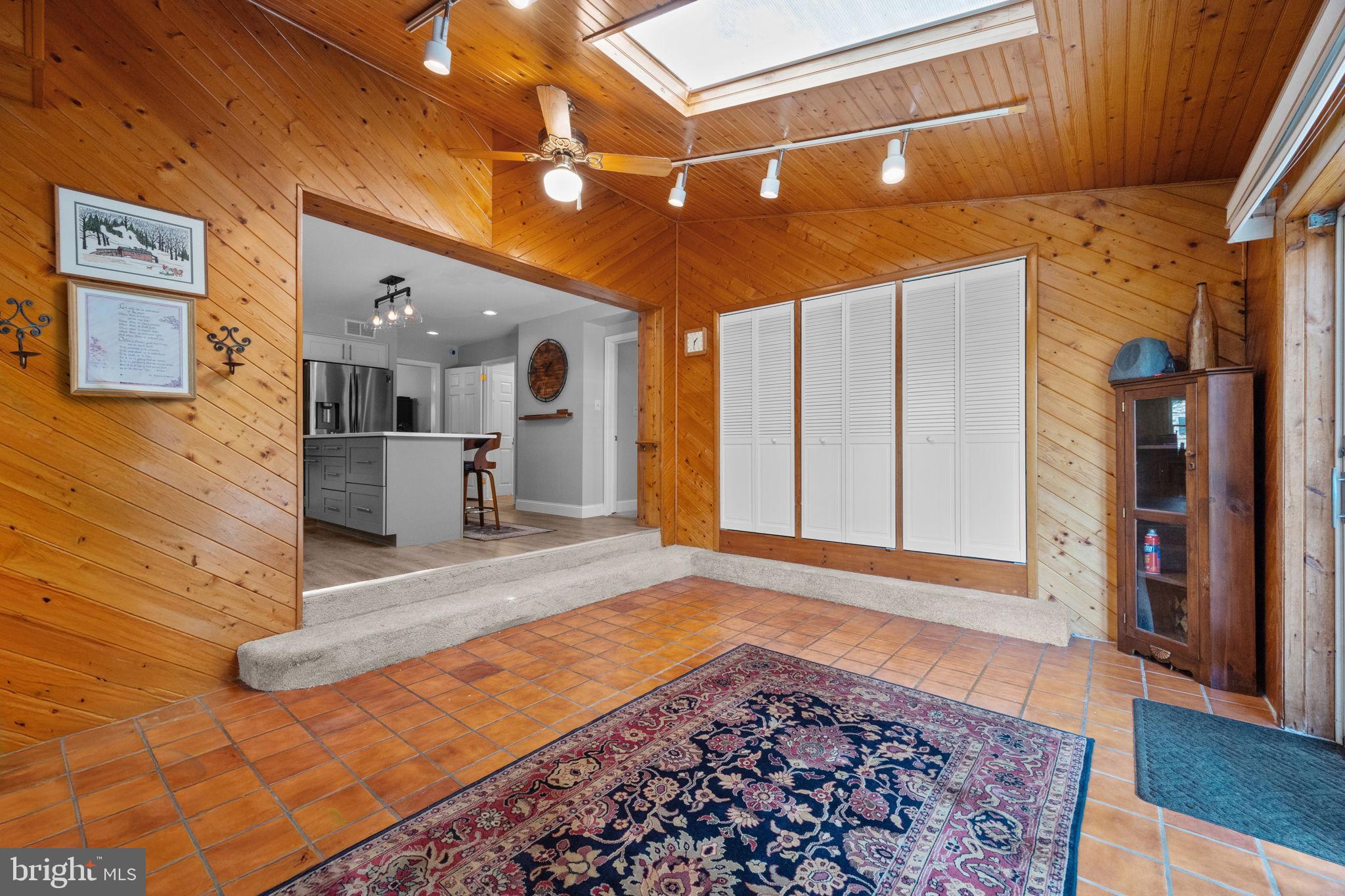 1708 Madeira Avenue Jenkintown, PA 19046 - Photo 21 of 63 a view of a hallway with wooden floor and a fireplace