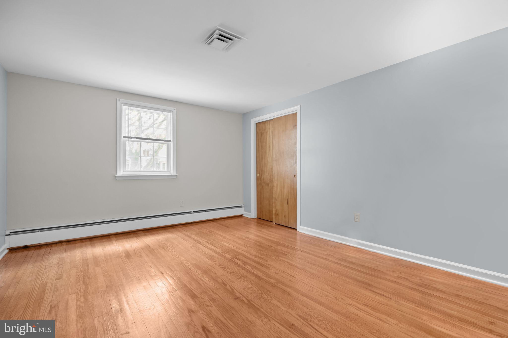 1708 Madeira Avenue Jenkintown, PA 19046 - Photo 30 of 63 an empty room with wooden floor and windows