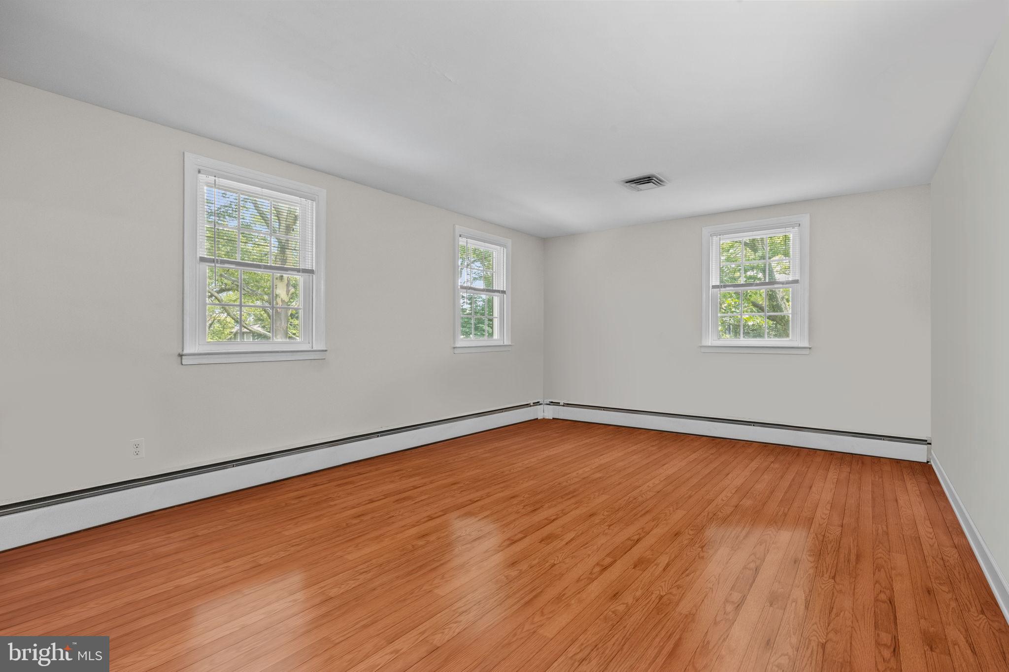 1708 Madeira Avenue Jenkintown, PA 19046 - Photo 31 of 63 a view of an empty room with window and wooden floor