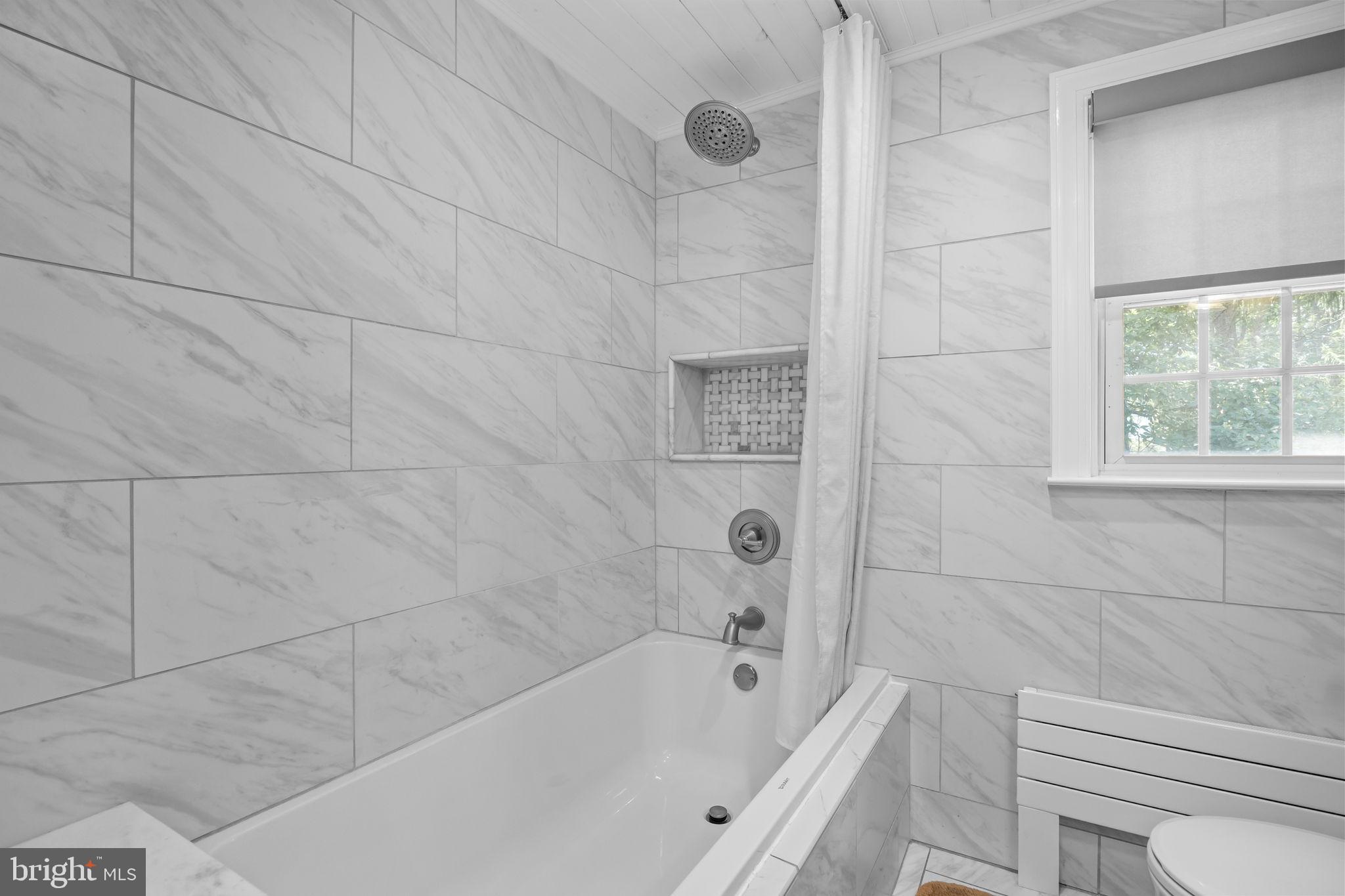 1708 Madeira Avenue Jenkintown, PA 19046 - Photo 34 of 63 a bathroom with a bathtub and shower