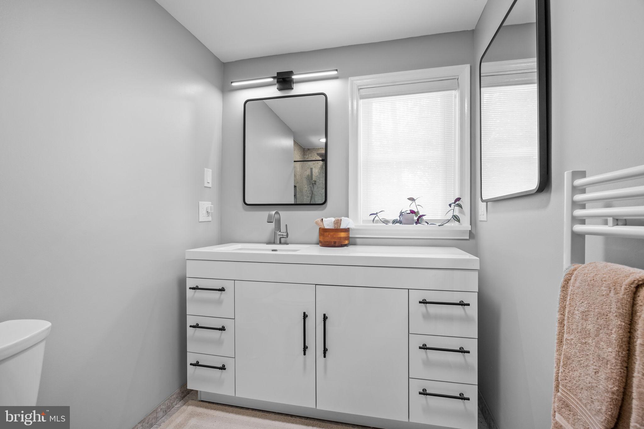 1708 Madeira Avenue Jenkintown, PA 19046 - Photo 40 of 63 a bathroom with a sink vanity and a mirror