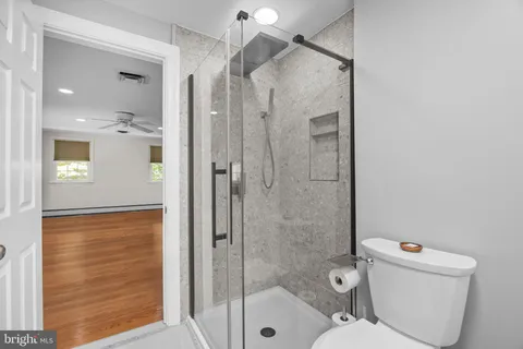 a view of a chairs and tables in the back yard of the house