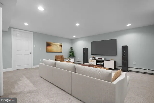 a view of a grassy field with trees in the background