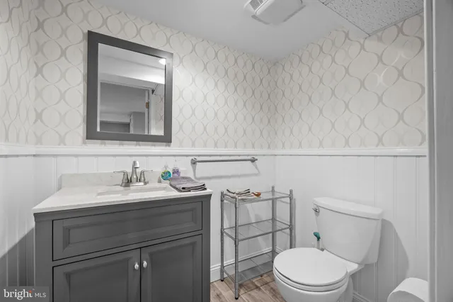 an aerial view of multiple houses with yard