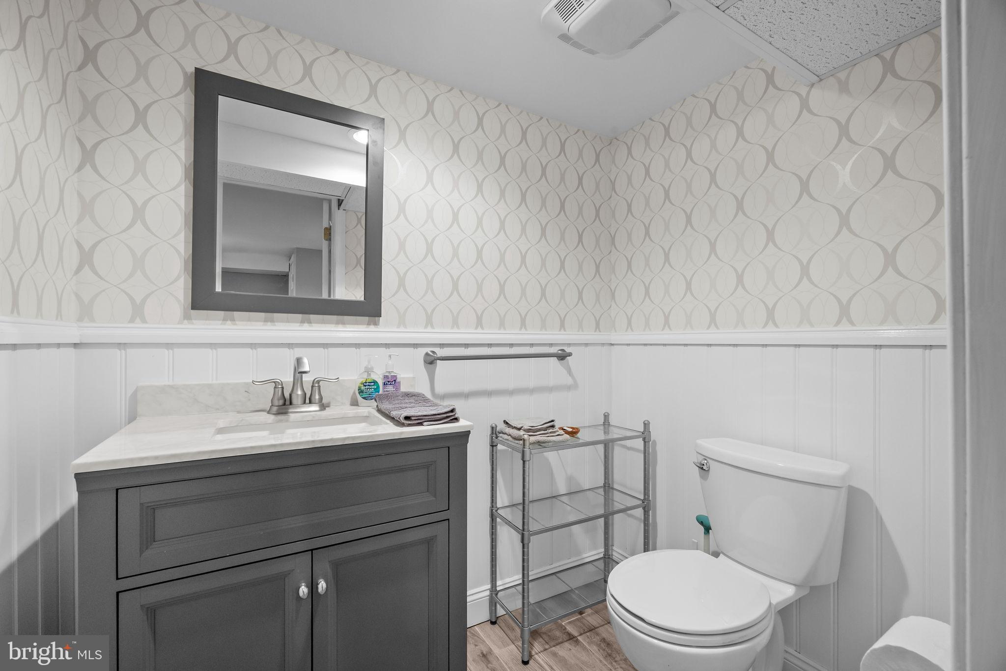 1708 Madeira Avenue Jenkintown, PA 19046 - Photo 48 of 63 a bathroom with a toilet a sink and mirror