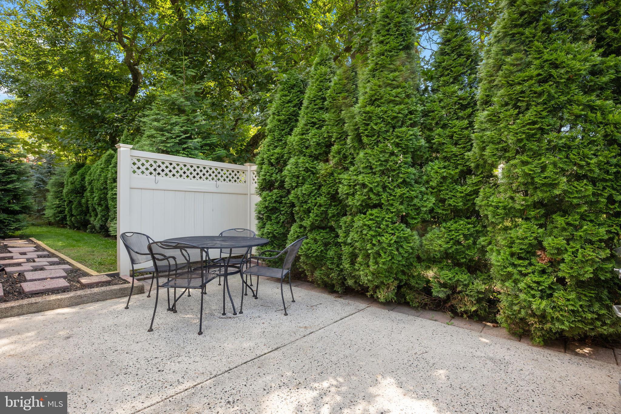 1708 Madeira Avenue Jenkintown, PA 19046 - Photo 52 of 63 a patio with table and chairs and potted plants