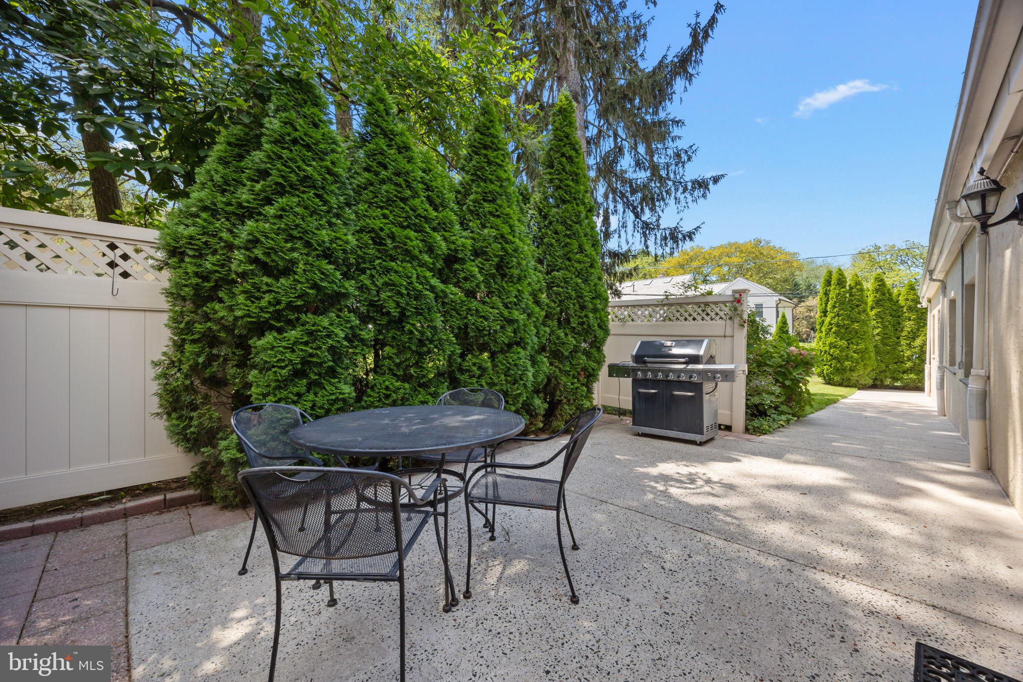 1708 Madeira Avenue Jenkintown, PA 19046 - Photo 53 of 63 a view of a chairs and tables in the back yard of the house