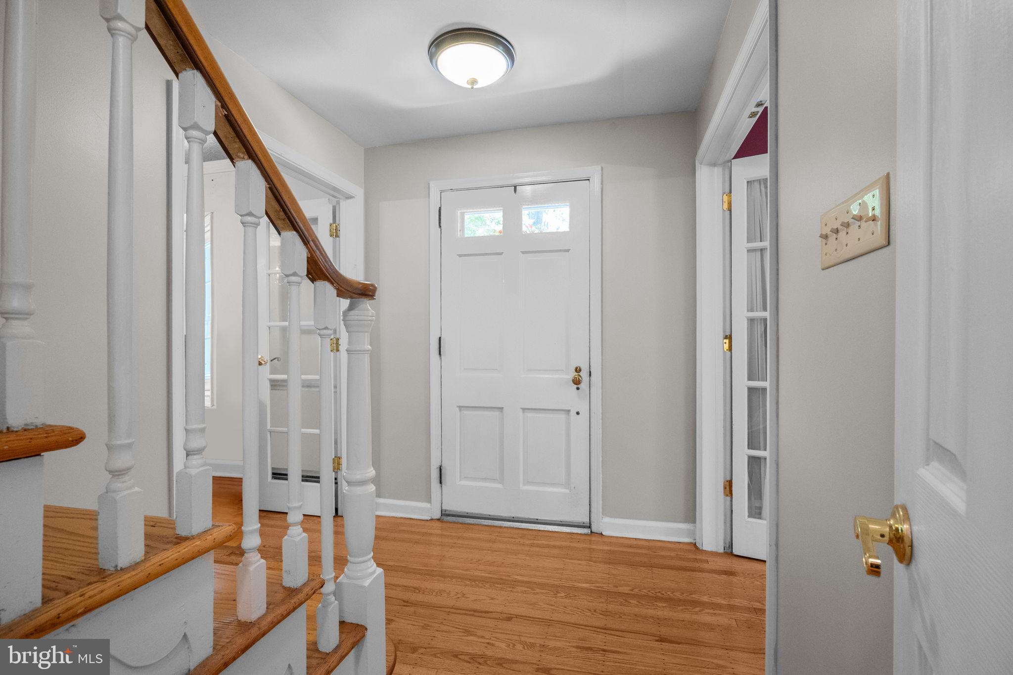 1708 Madeira Avenue Jenkintown, PA 19046 - Photo 7 of 63 a view of an entryway with wooden floor and door