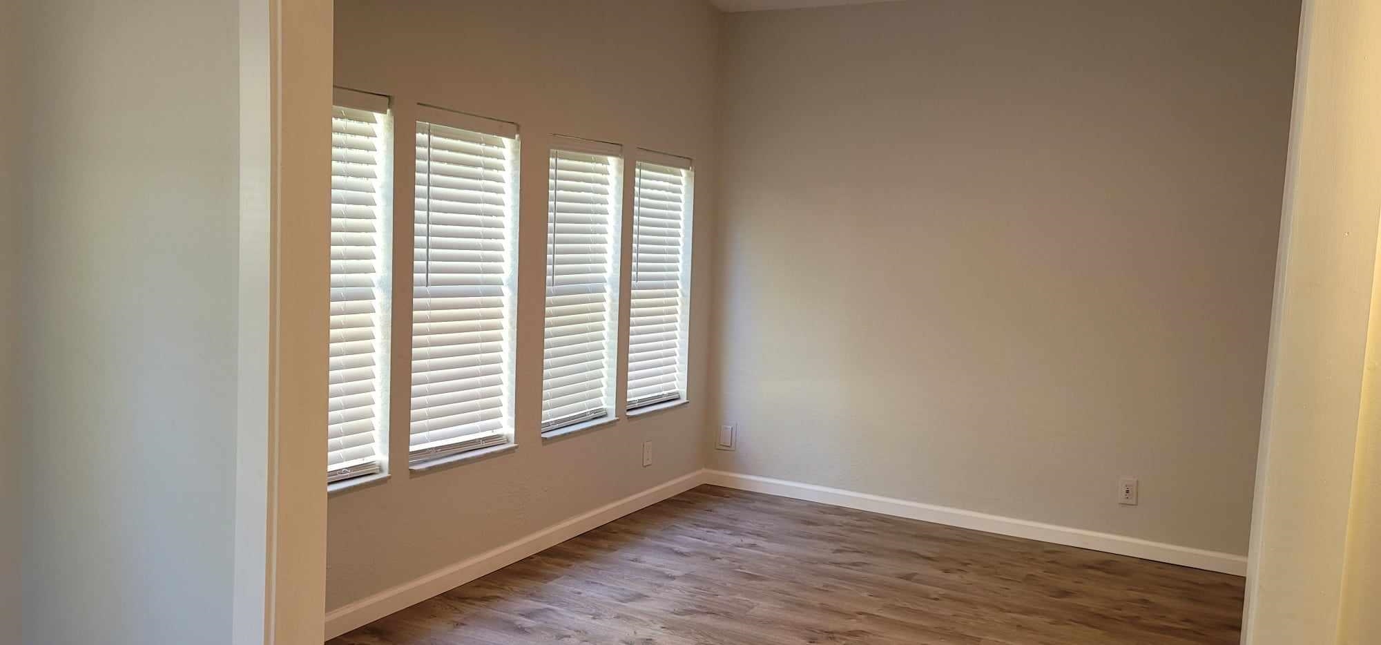 7772 Highway 1, Unit A St. Augustine, FL 32086 - Photo 11 of 14 an empty room with wooden floor and windows