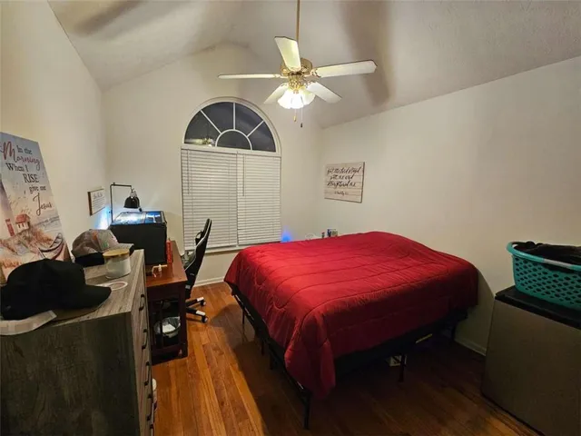 a bed room with a bed and a chandelier