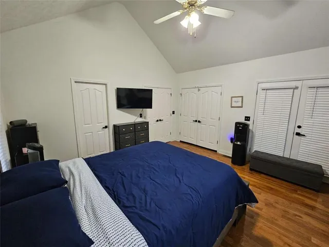 a bed room with a bed and a television