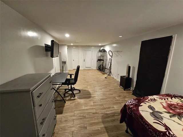 a room with furniture and a flat screen tv