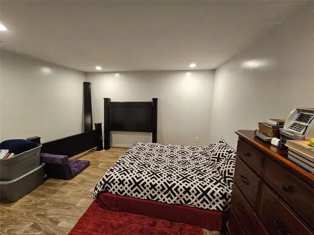 a bed room with a bed and a television