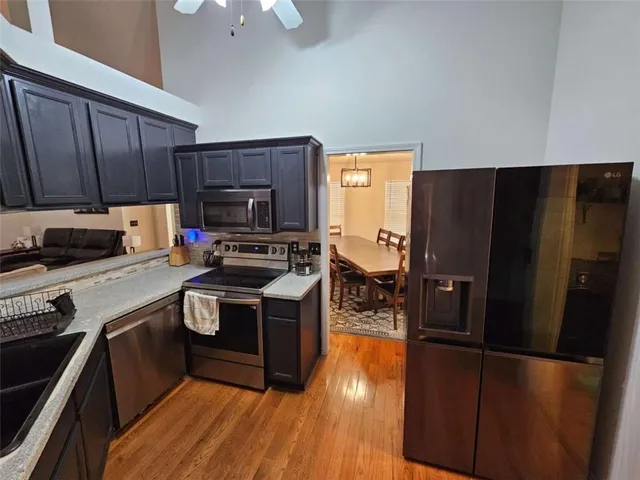 a kitchen with a refrigerator stove and sink
