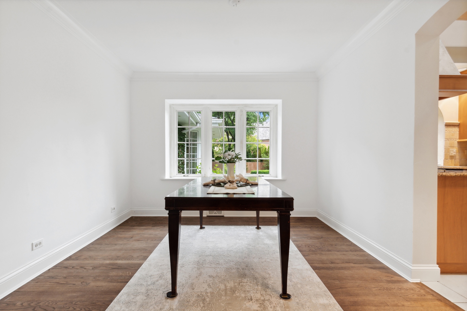 1224 Ridgewood Drive Northbrook, IL 60062 - Photo 11 of 34 a view of a room that has a window and a table in it