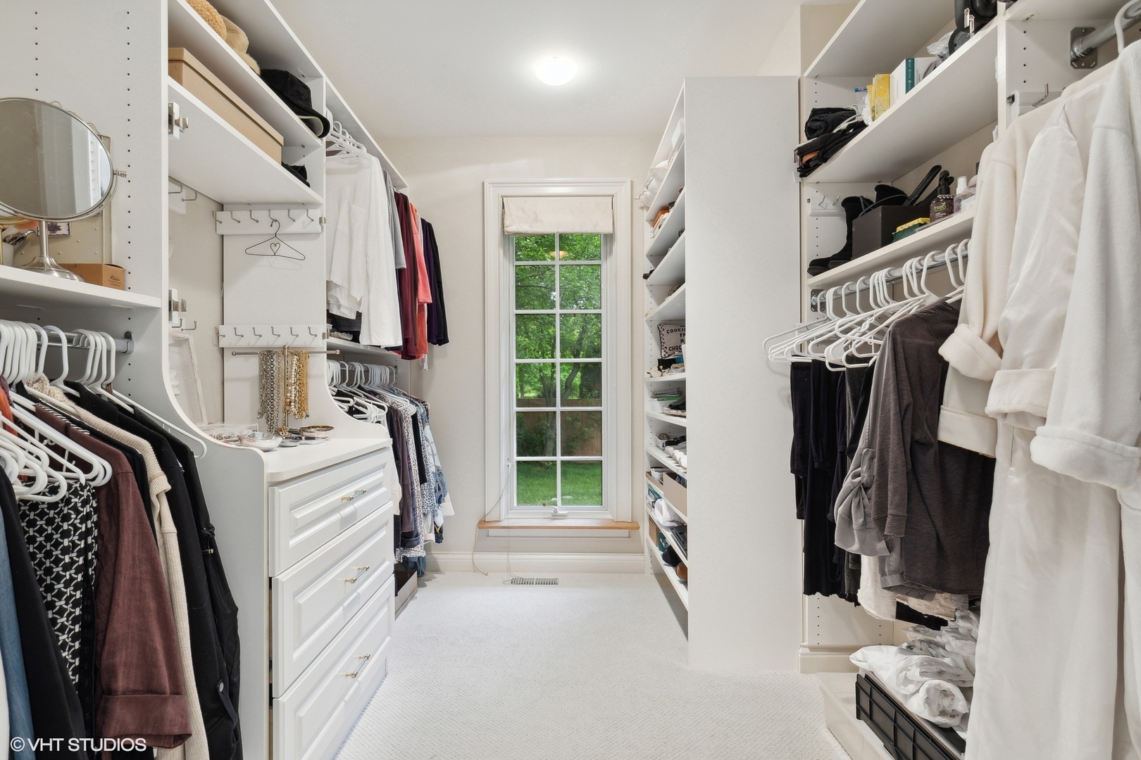 1224 Ridgewood Drive Northbrook, IL 60062 - Photo 19 of 34 a view of walk in closet with clothes and shoes