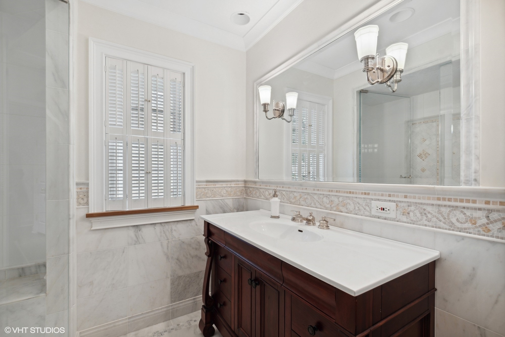 1224 Ridgewood Drive Northbrook, IL 60062 - Photo 23 of 34 a bathroom with a sink vanity and a mirror