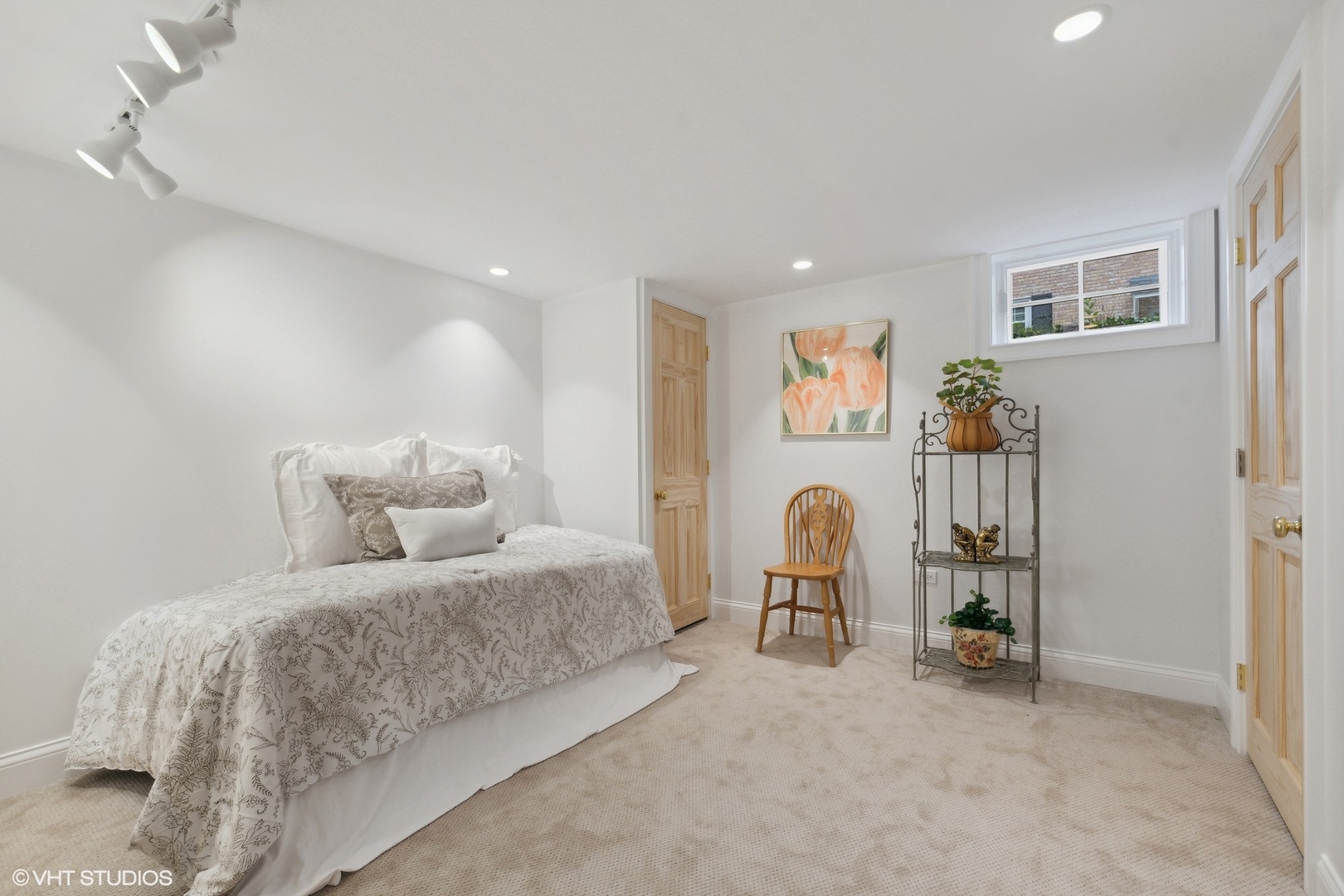 1224 Ridgewood Drive Northbrook, IL 60062 - Photo 28 of 34 a bedroom with a bed and a chair