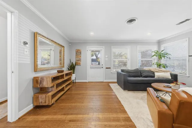 a living room with furniture and a rug