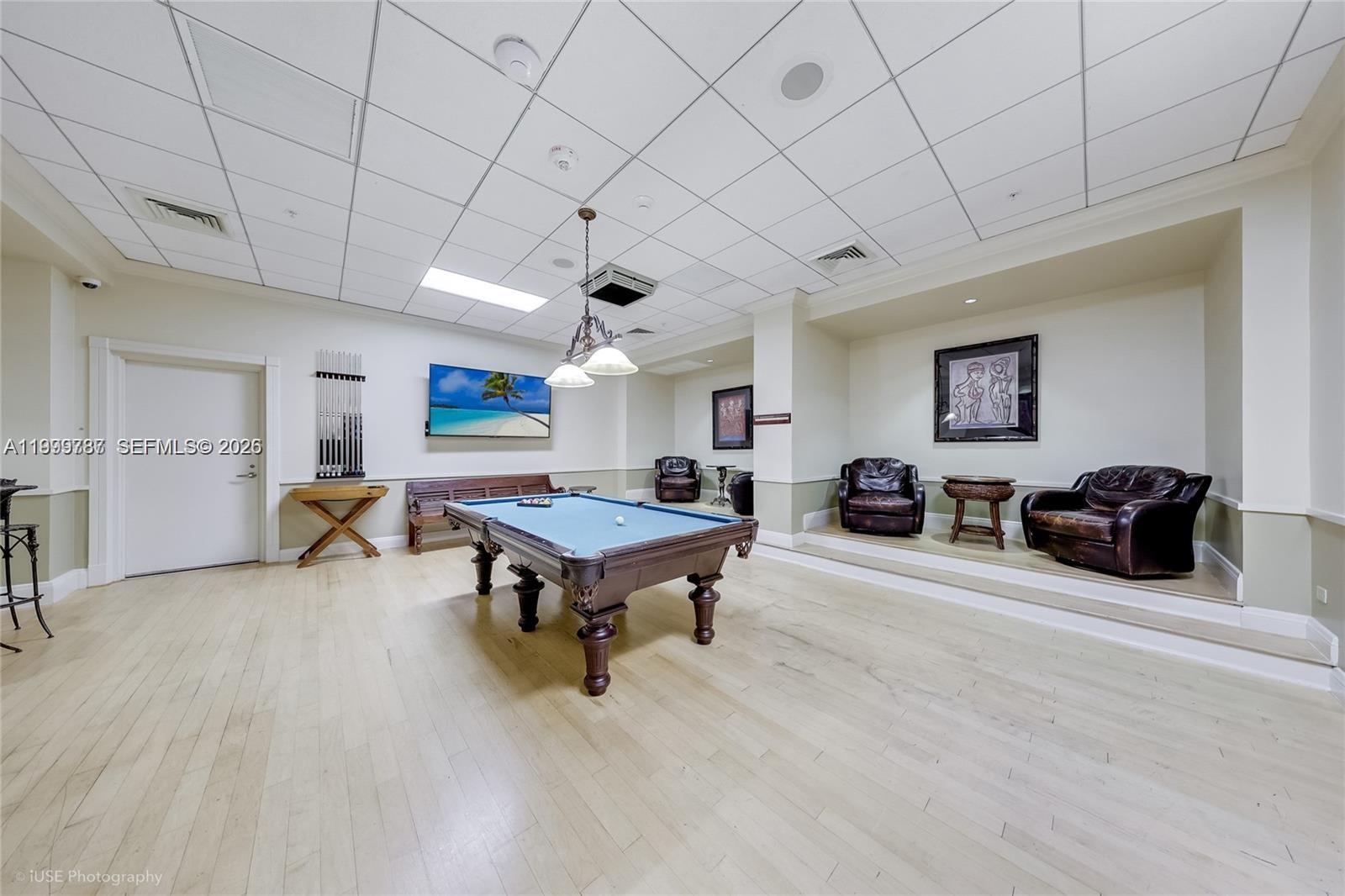 701 Brickell Key Boulevard, Unit 503 Miami, FL 33131 - Photo 21 of 25 a room with furniture pool table and a window